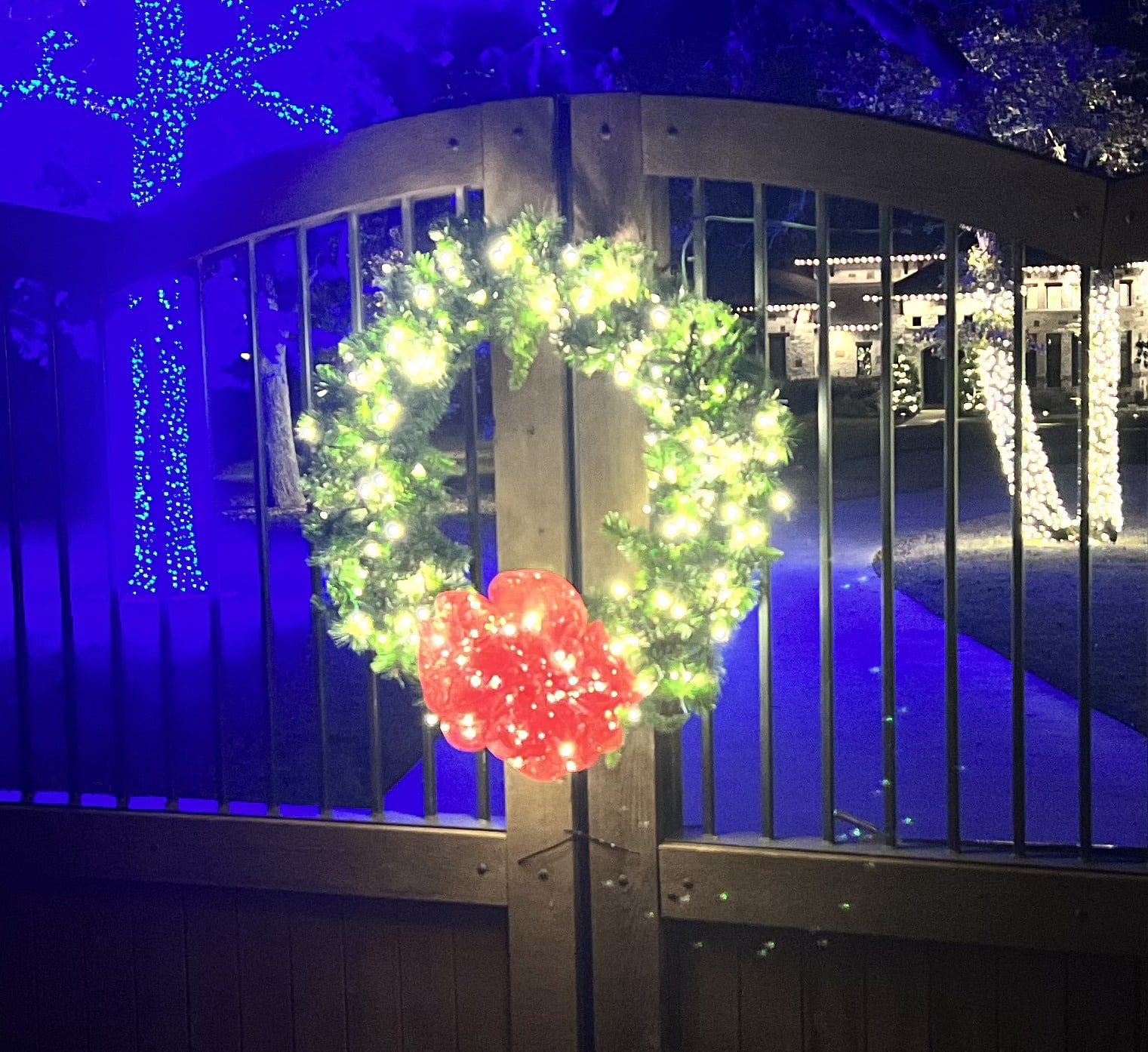 Decorative Wreaths installed along fence during Christmas time.