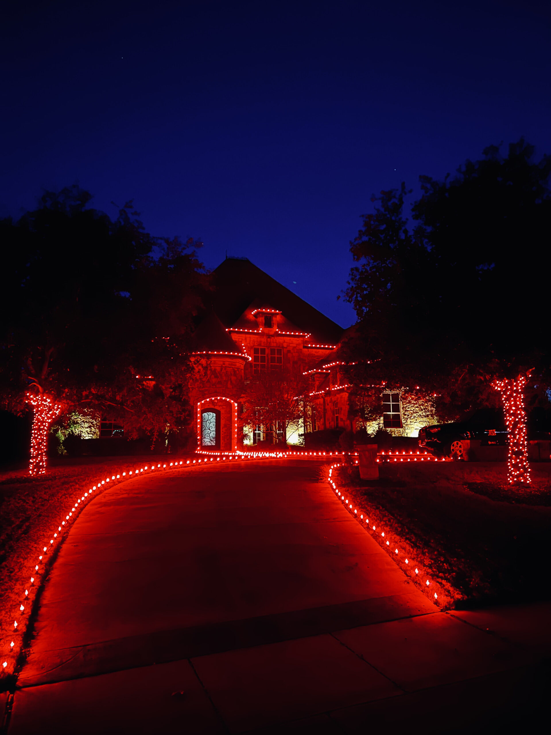 House decorated with professionally designed Christmas light packages.